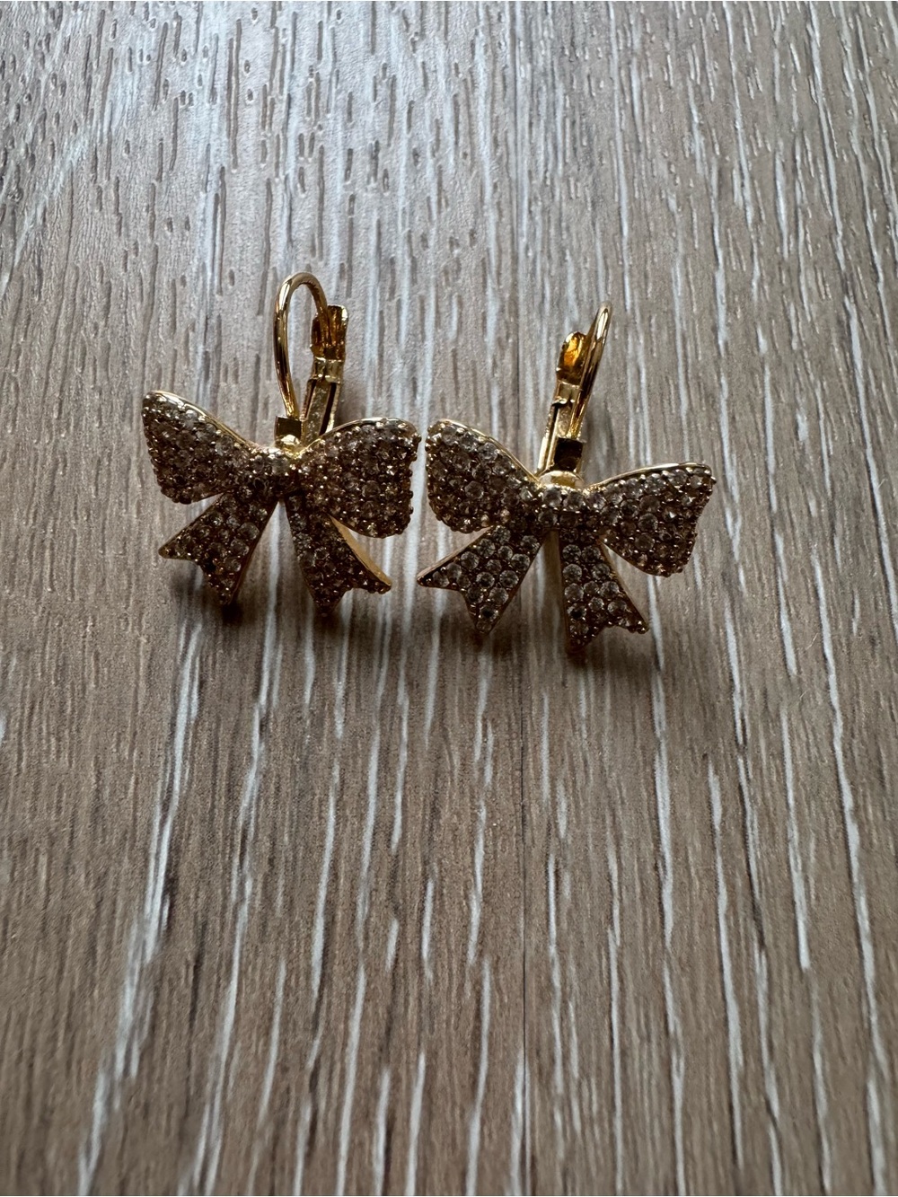 Clear rhinestone encrusted bow earrings